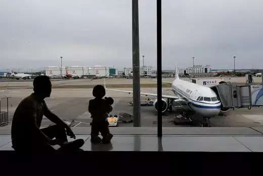 Passengers await boarding for flights at Beijing Capital International Airport in Beijing, China.