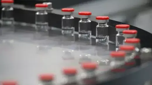 A view shows vials with red caps during the production of vaccine against the coronavirus disease. 