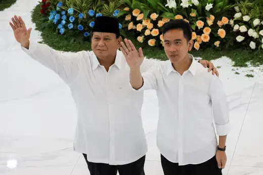 President-elect Prabowo Subianto and vice president-elect Gibran Rakabuming Raka wave after the country's election commission officially announced them as the presidential election winners in Jakarta, April 24, 2024. 