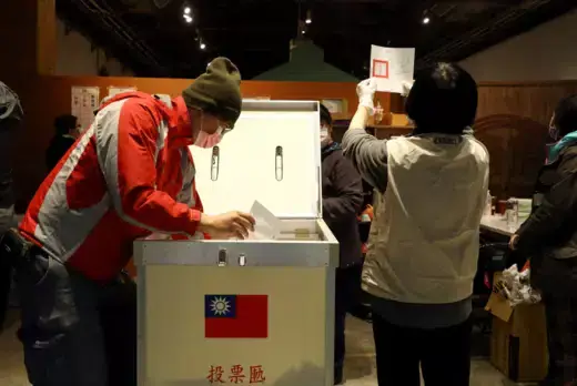 Electoral workers count votes for a 2021 referendum at a ballot counting center in Taipei, Taiwan.