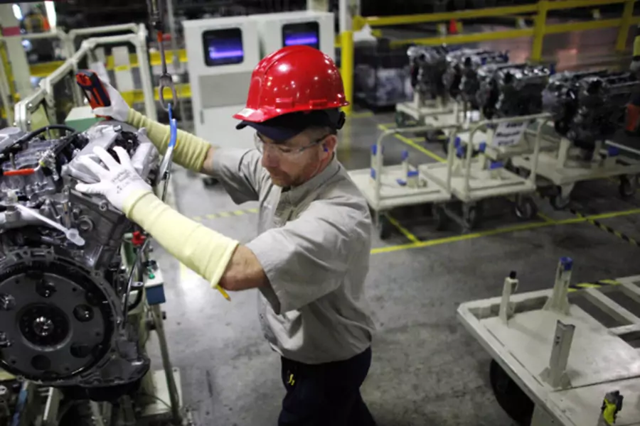 A Toyota automaker employee moves an engine at the Toyota assembly line in Huntsville, Alabama (Carlos Barria/Courtsey Reuters).