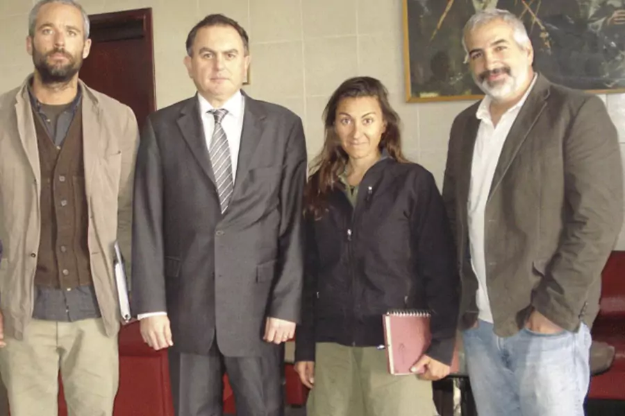 Anthony Shadid (right) with other New York Times journalists and Turkey's Ambassador to Libya on March 21, 2011. (Handout/courtesy Reuters)