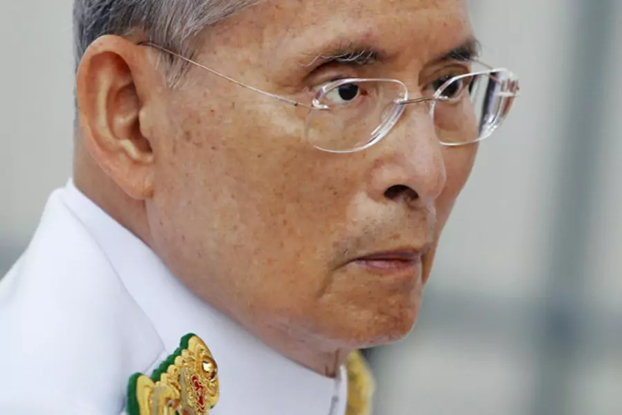 Under Thailand’s lèse-majesté law, criticism of King Bhumibol Adulyadej (pictured in Bangkok June 9, 2012) and the royal family is prohibited.