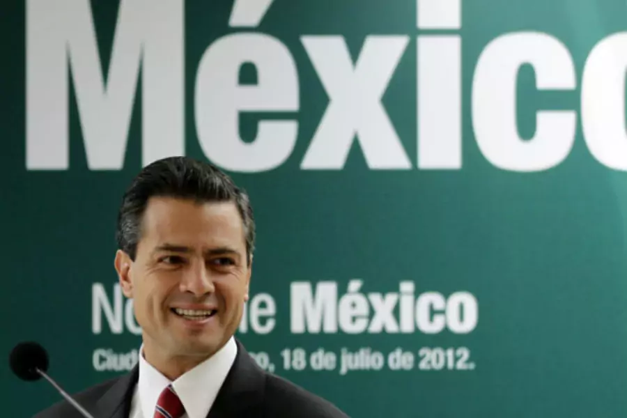 Mexico's President-elect Enrique Pena Nieto smiles during a news conference in Mexico City