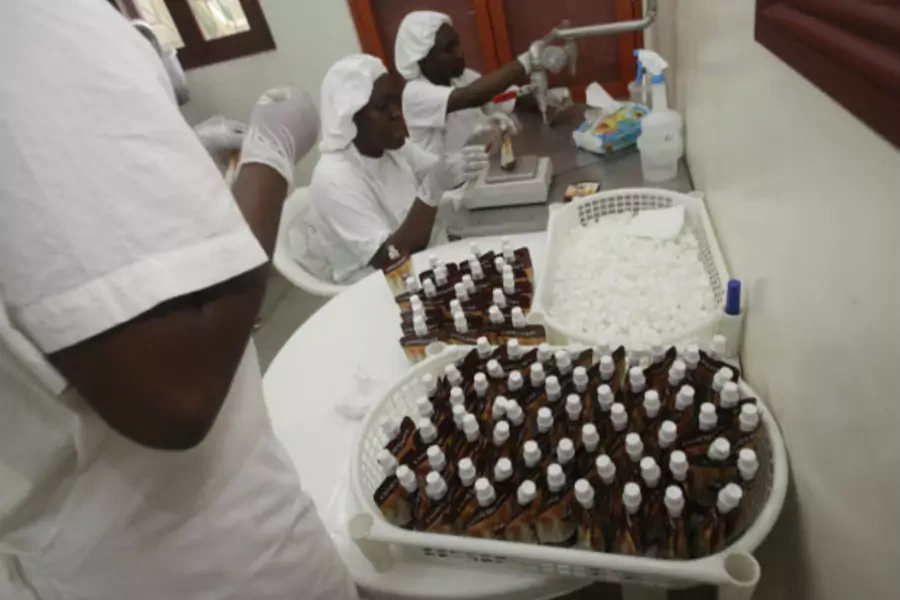 Employees work at a cocoa micro-manufacturing plant owned by Olga Yenou, an Ivorian woman, in Abidjan on November 29, 2011 (Thierry Gouegnon/Courtesy Reuters).