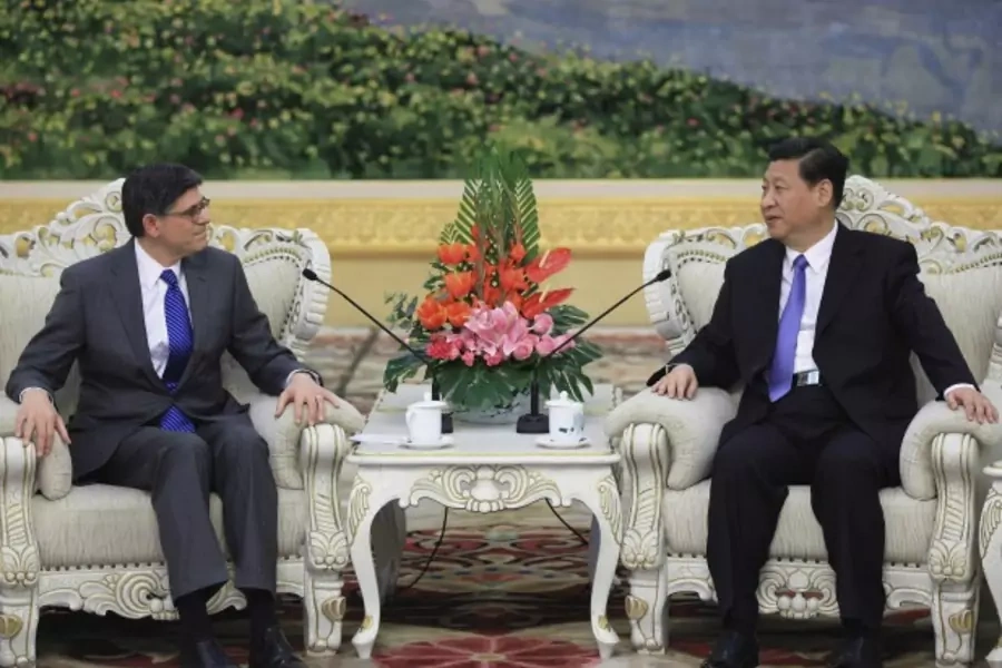 U.S. Treasury Secretary Jacob Lew (L) speaks with China's President Xi Jinping during their meeting at the Great Hall of the People in Beijing on March 19, 2013.