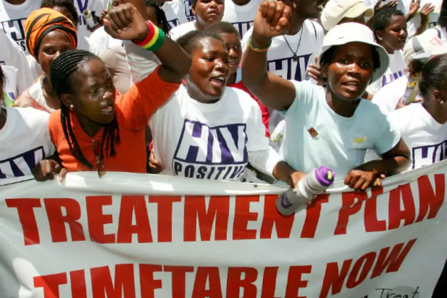Aids activists protest against the slow roll-out of antiretroviral drugs by the South African government in Cape Town on November 4, 2004 (Mike Hutchings/Courtesy Reuters).