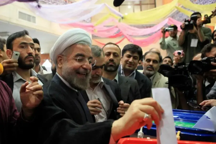 Presidential candidate Hassan Rouhani casts his ballot during the Iranian presidential election, June 14, 2013 (Yalda Moayeri/Courtesy Reuters)