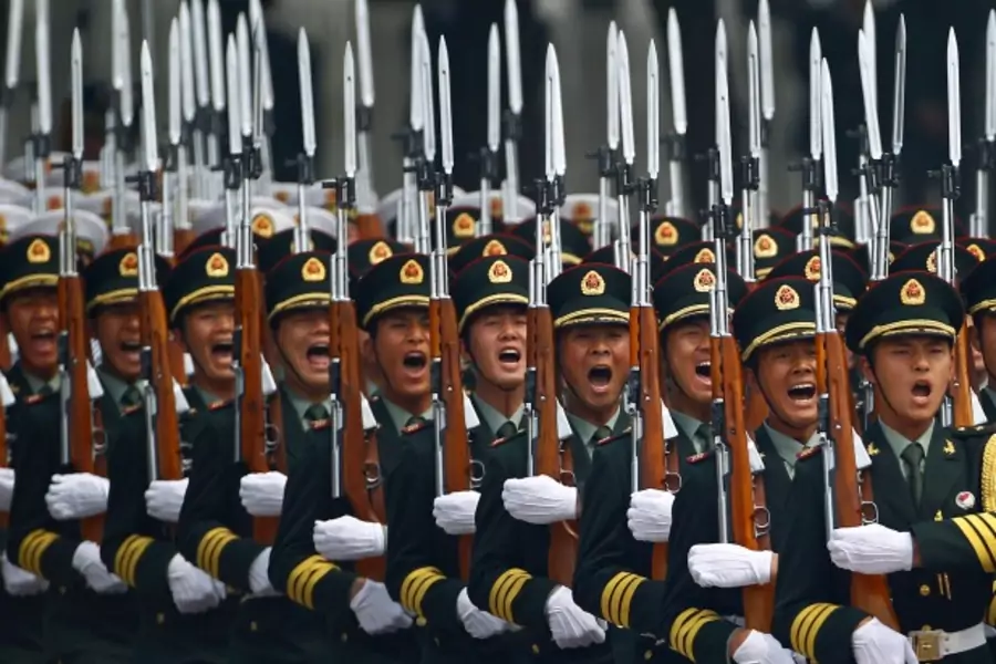 Honour guard troops march during a welcoming ceremony for visiting Palestinian President Mahmoud Abbas outside the Great Hall of the People in Beijing on May 6, 2013. (Petar Kujundzic/Courtesy Reuters)