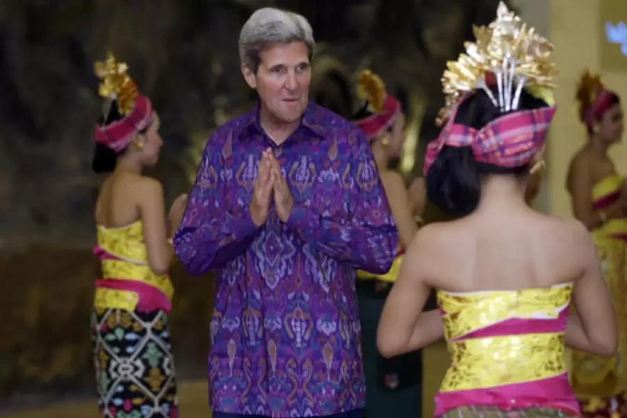 U.S. Secretary of State John Kerry gestures as he arrives for the Asia-Pacific Economic Cooperation (APEC) Summit official dinner in Nusa Dua on the Indonesian resort island of Bali on October 7, 2013. (Pool New/Courtesy Reuters)
