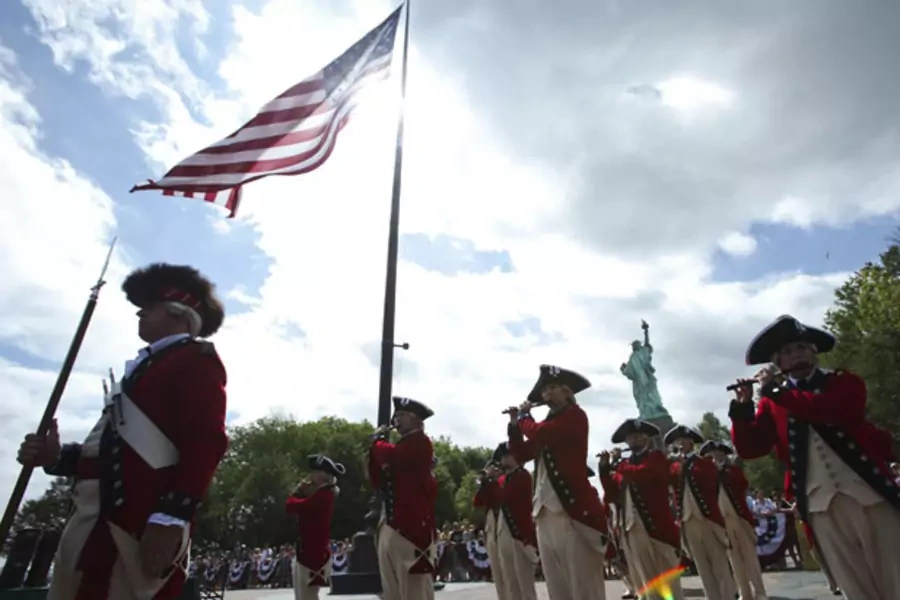 U.S. soldiers mark Independence Day at the Statue of Liberty. 