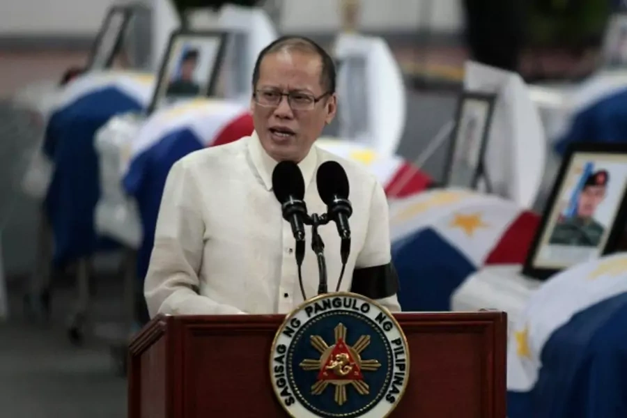 Philippine President Benigno Aquino delivers a speech in front of the caskets of the slain members of the Special Action Force...uge with Moro Islamic Liberation Front (MILF) fighters. REUTERS/Romeo Ranoco (PHILIPPINES - Tags: POLITICS CRIME LAW MILITARY)
