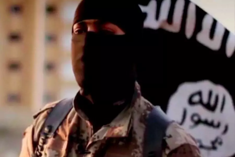 A masked man speaking in what is believed to be a North American accent in a video released by Islamic State in Iraq and Syria...s in September 2014 is pictured in this still frame from video obtained by Reuters (Courtesy Reuters/FBI/Handout via Reuters).