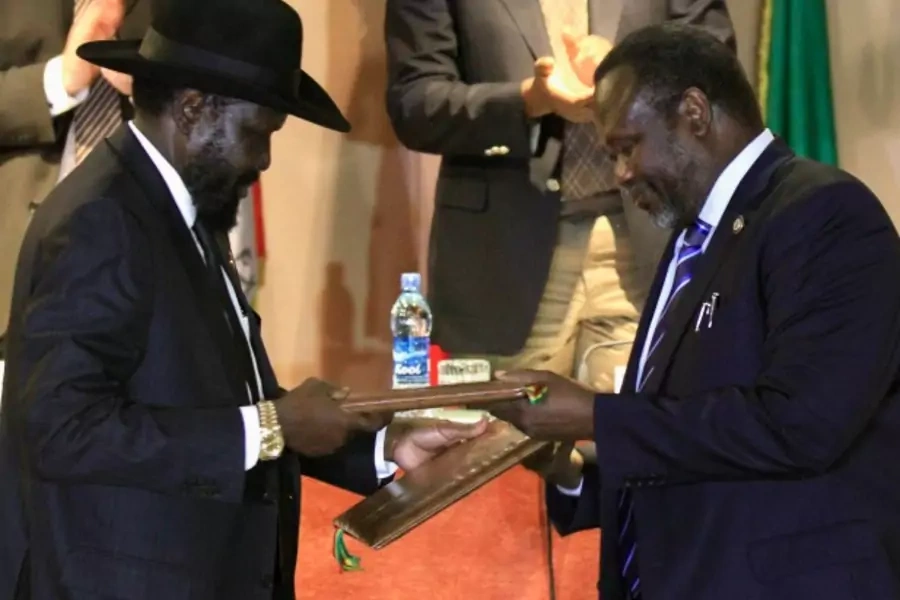 South Sudan's president Salva Kiir and rebel commander Riek Machar attend the signing a ceasefire agreement during the Inter G...ment (IGAD) Summit on the case of South Sudan in Ethiopia's capital Addis Ababa, Feburary 1, 2015 (Courtesty Reuters/ Negeri).