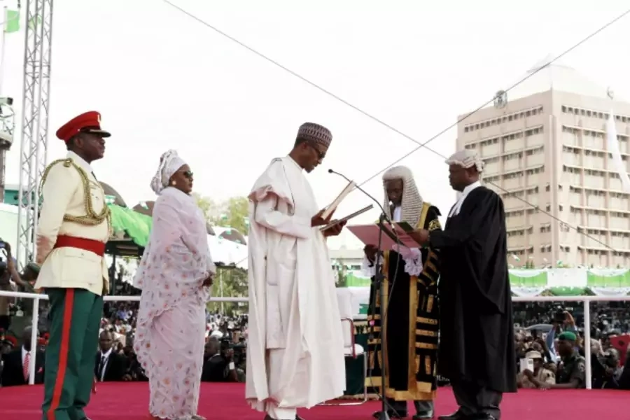 Chief Justice of Nigeria Mahmud Mohammed swears in Muhammadu Buhari (C) as Nigeria's president while Buhari's wife Aisha looks on at Eagle Square in Abuja, Nigeria May 29, 2015. (Afolabi Sotunde/Reuters)