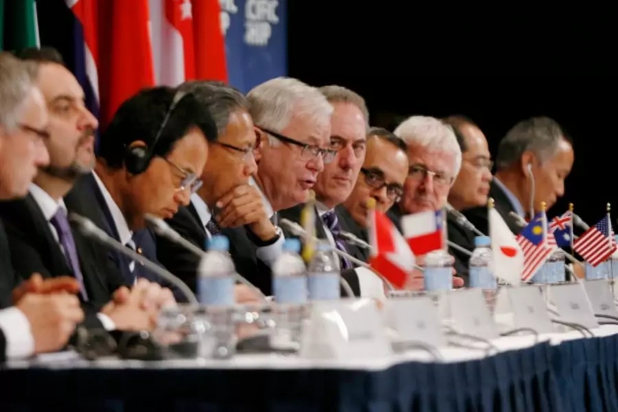 Australia's Trade Minister Andrew Robb (6th R) speaks at a news conference at the end of the Trans Pacific Partnership (TPP) meeting of trade representatives in Sydney, October 27, 2014. REUTERS/Jason Reed (AUSTRALIA - Tags: BUSINESS POLITICS)