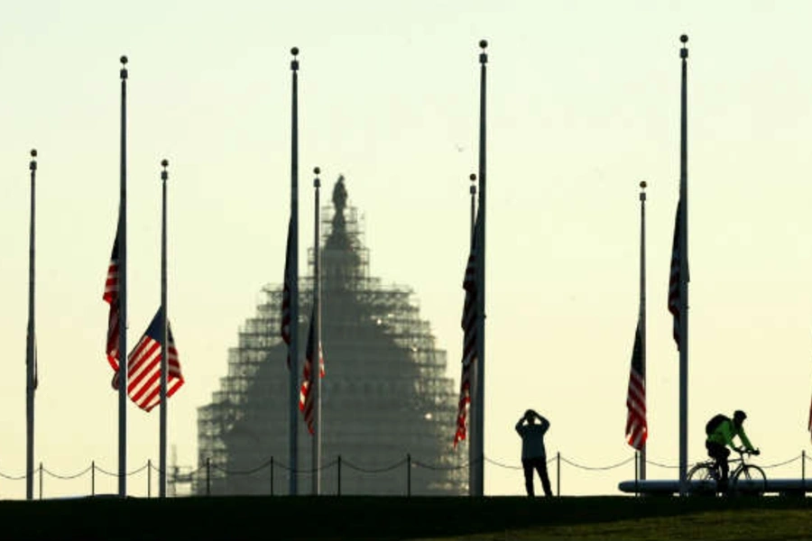 American flags fly at half-staff to honor the victims of the Paris attacks. (Kevin Lamarque/Courtesy Reuters)