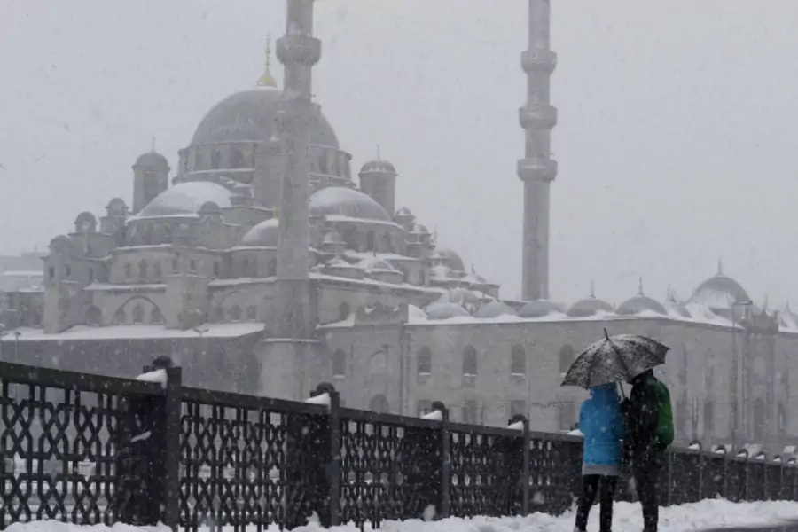 Tourists stroll on the snow-covered Galata bridge in Istanbul, Turkey (Osman Orsal/Reuters).