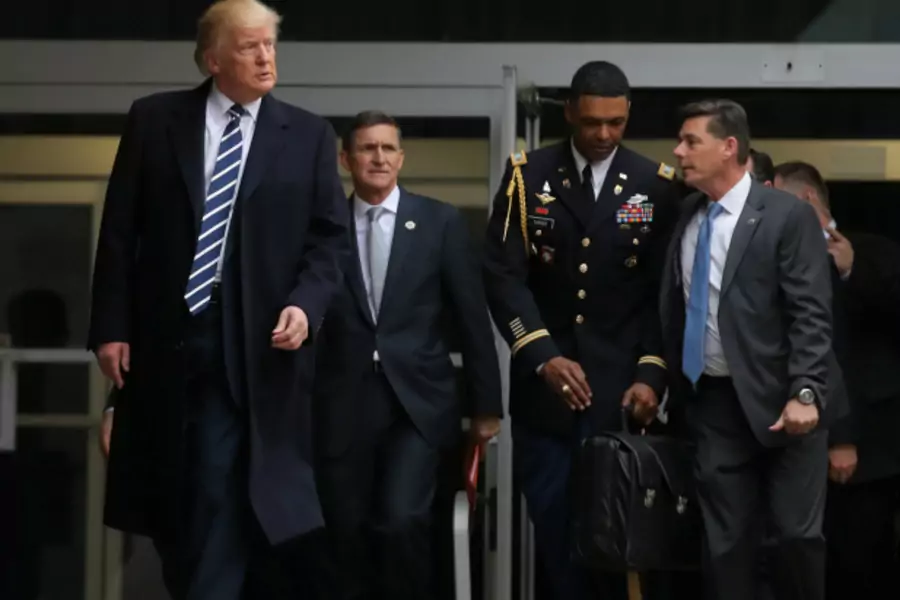 U.S. President Donald Trump leaves the Central Intelligence Agency (CIA) headquarters accompanied by National security adviser General Michael Flynn (2nd L) after delivering remarks during a visit in Langley, Virginia (Carlos Barria/Reuters).