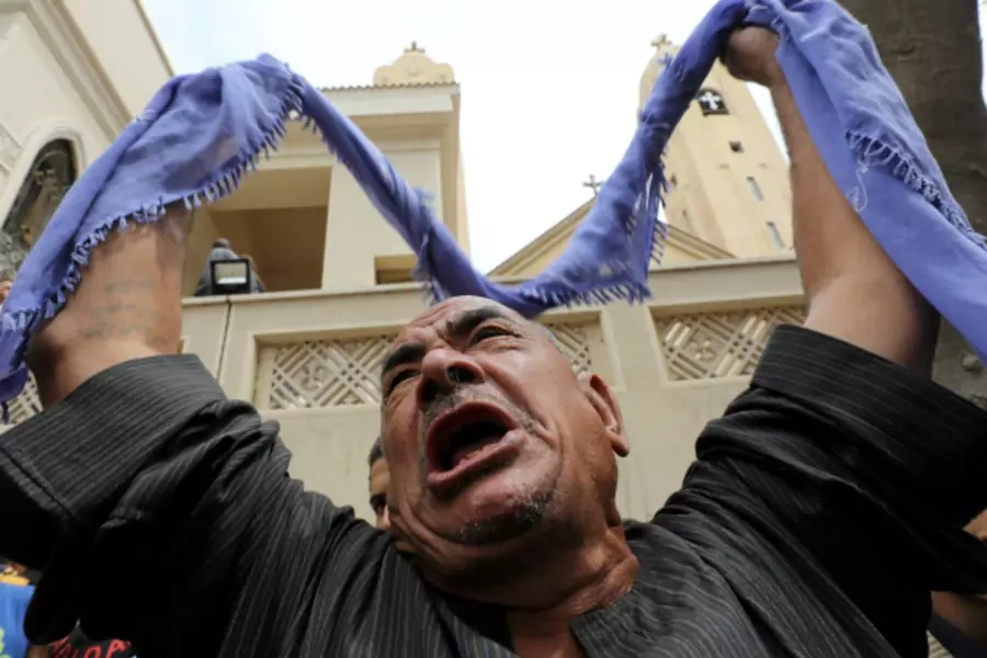 A relative of one of the victims reacts after a church explosion killed at least 21 in Tanta, Egypt (Mohamed Abd El Ghany/Reuters).