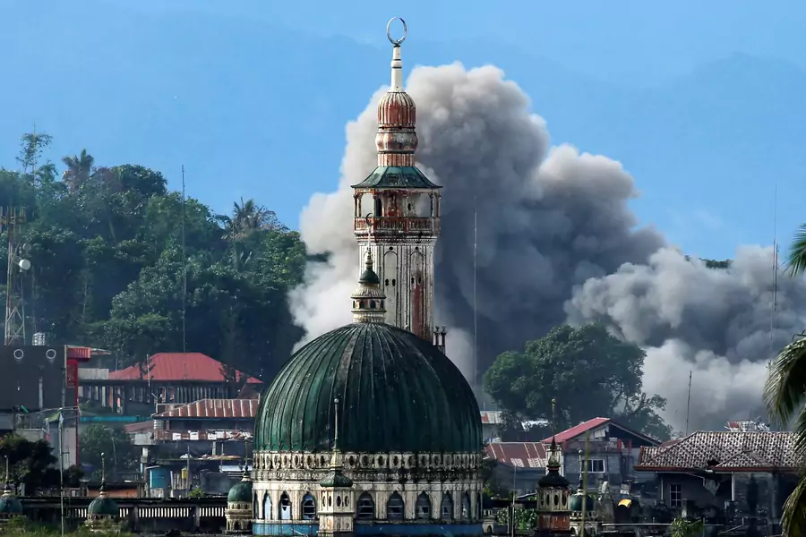 An explosion is seen following a Philippine Army airstrike as government troops continue their assault against insurgents from the Maute group in Marawi city, Philippines on June 29, 2017. 