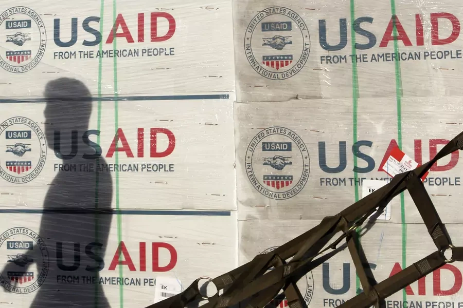 The shadow of a Philippine Army personnel is cast on boxes of relief items from U.S. Agency for International Development (USAID), November 13, 2013. 