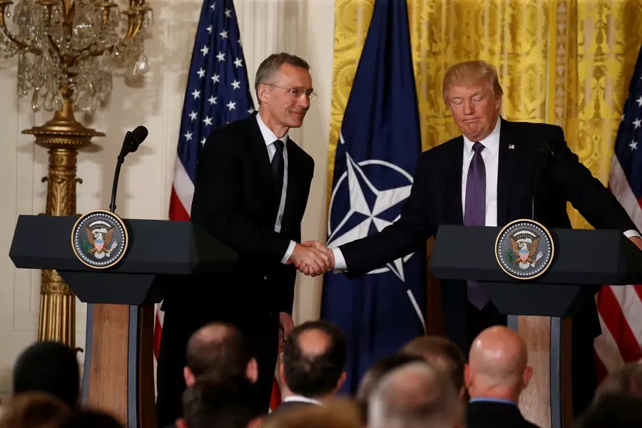 U.S. President Donald Trump and NATO Secretary-General Jens Stoltenberg shake hands during a joint news conference on April 12, 2017. 