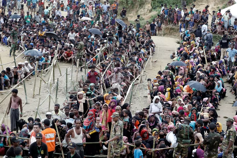 Rohingya refugees queue for aid at Cox's Bazar, Bangladesh, on September 26, 2017. 