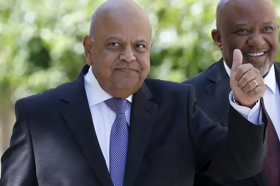 South Africa's Finance Minister Pravin Gordhan gestures as he arrives to deliver his 2016 budget address to the parliament in Cape Town, February 24, 2016. 
