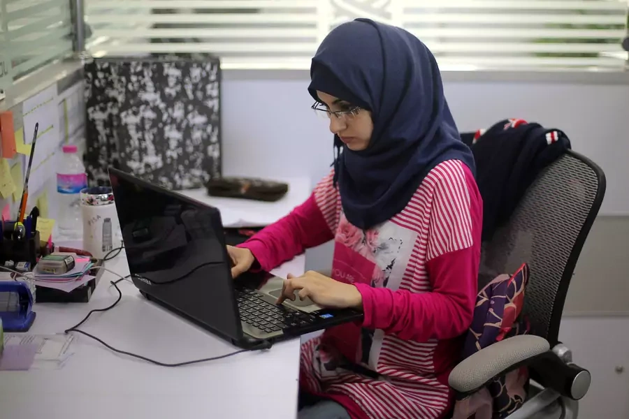 Entrepreneur Samar Hijjo developed ''Baby Sitter," a mobile application aimed at raising awareness of women during pregnancy and after child birth; here she works at UCAS Technology Incubator office in Gaza City, October 31, 2016.