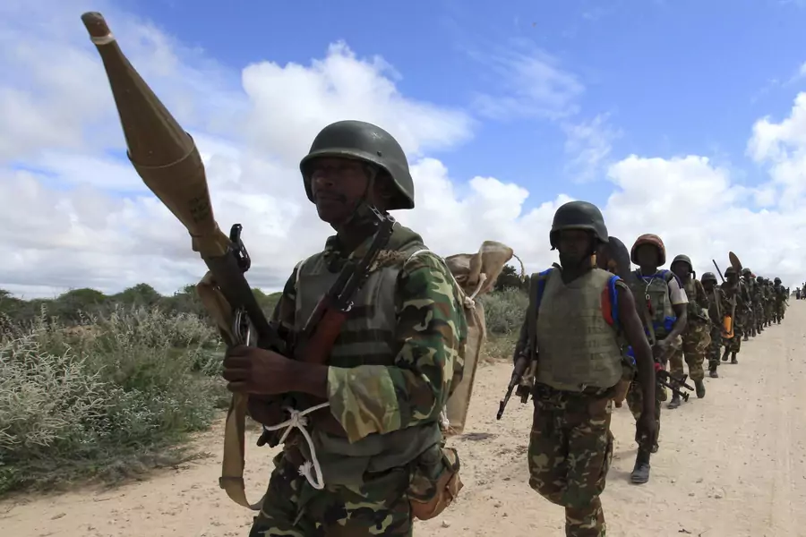 African Union Mission in Somalia (AMISOM) peacekeepers patrol after fighting between insurgents and government soldiers erupted on the outskirts of Mogadishu in May 2012.