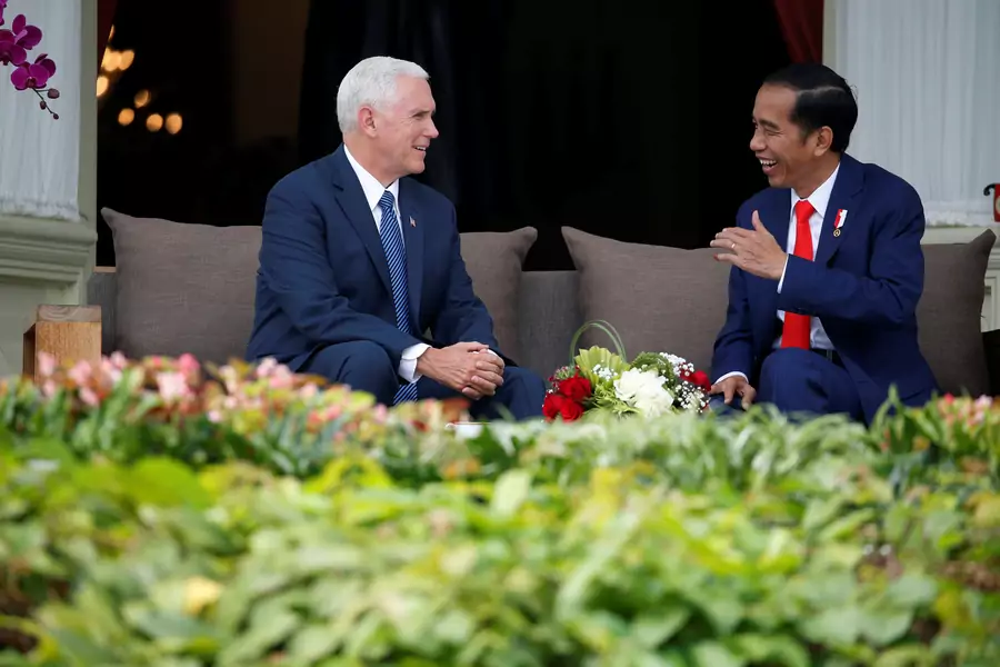 U.S. Vice President Mike Pence talks to Indonesia's President Joko Widodo, at the veranda of the Presidential Palace in Jakarta, Indonesia on April 20, 2017.