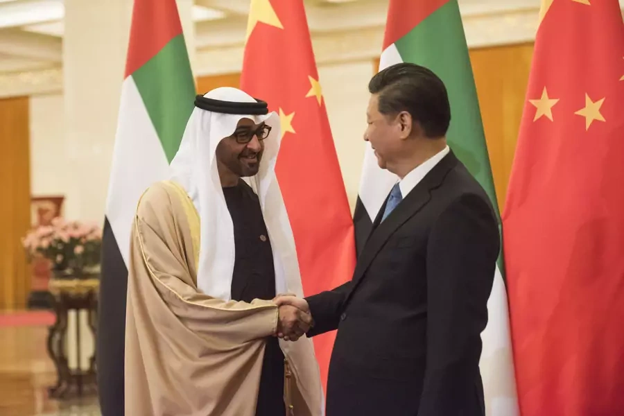 Sheikh Mohammed bin Zayed al-Nahyan (L), Crown Prince of Abu Dhabi and UAE's deputy commander-in-chief of the armed forces shakes hands with Chinese President Xi Jinping (R) at the Great Hall of the People, Beijing, December 14, 2015
