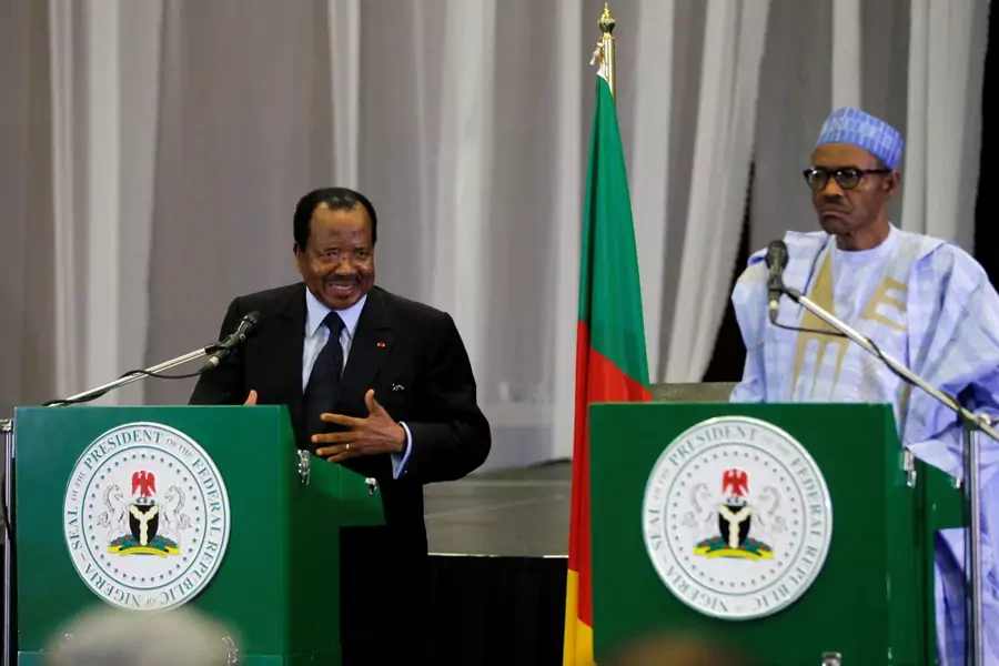 Cameroon's President Paul Biya (L) speaks during a joint news conference with Nigeria's President Muhammadu Buhari in Abuja, Nigeria, on May 4, 2016.