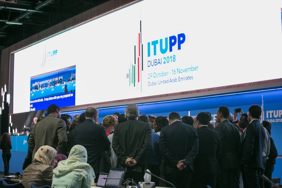 A group huddle to informally negotiate text at the 2018 ITU plenipotentiary conference in Dubai, UAE. 