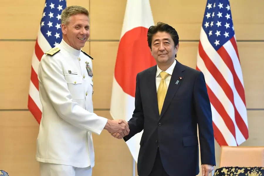 Admiral Phil Davidson, commander of U.S. Indo-Pacific Command, shakes hands with Japan's Prime Minister Shinzo Abe at Abe's office in Tokyo, Japan.