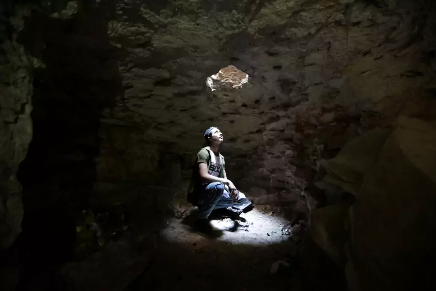 A man looks out from an underground cave in Idlib, Syria, on September 3, 2018.