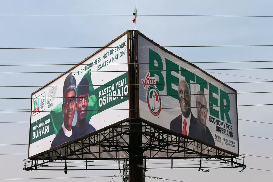 Campaign billboards with Nigeria's President Muhammadu Buhari with Vice President Yemi Osinbajo, and Nigeria's main opposition party presidential candidate Atiku Abubakar with his running mate, Peter Obi, in Abuja, Nigeria, on February 5, 2019.