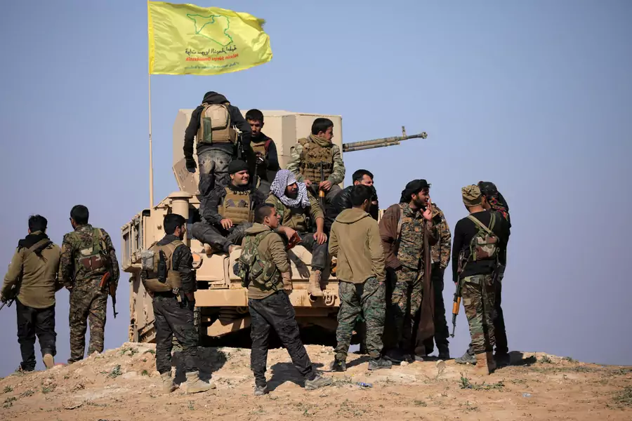 Members of Syrian Democratic Forces stand together near Baghouz, Syria, on February 12, 2019.