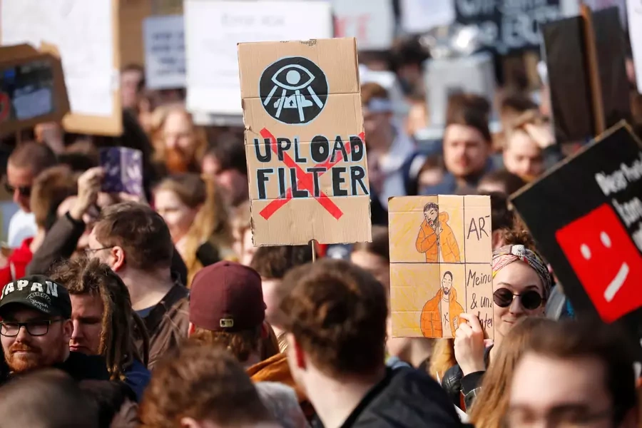 People protest against the planned EU copyright reform in Berlin, Germany March 23, 2019. 