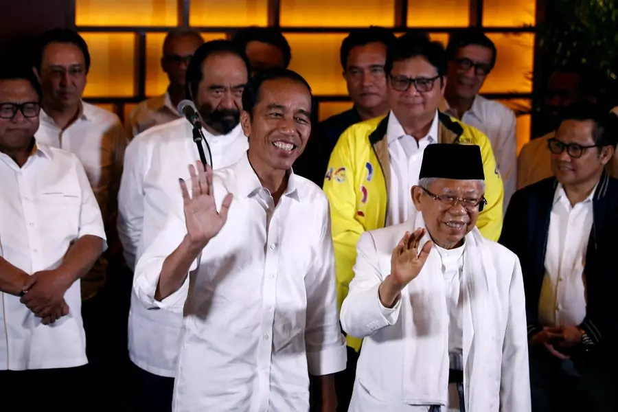 Indonesia's President Joko Widodo and his running mate Ma'ruf Amin react after a quick count result during the Indonesian elections in Jakarta, Indonesia on April 17, 2019.