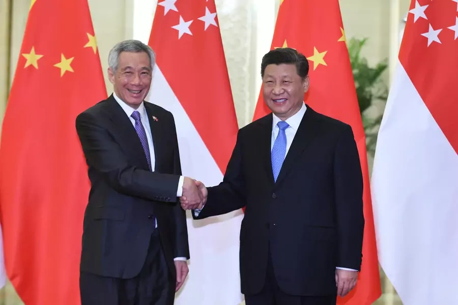 Singapore’s Prime Minister Lee Hsien Loong shakes hands with China's President Xi Jinping before their meeting at the Great Hall of the People in Beijing, China on April 29, 2019.