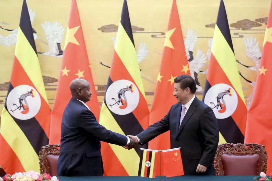 Ugandan President Yoweri Museveni shakes hands with Chinese President Xi Jinping during a signing ceremony in the Great Hall of the People in Beijing, on March 31, 2015.