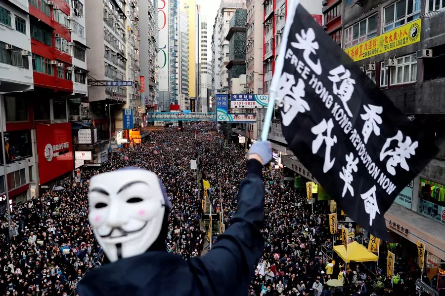 A protester waves a flag during a Human Rights Day march in Hong Kong. Danish Siddiqui/REUTERS
