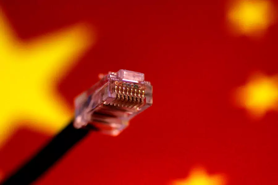 A computer network cable is seen above a Chinese flag