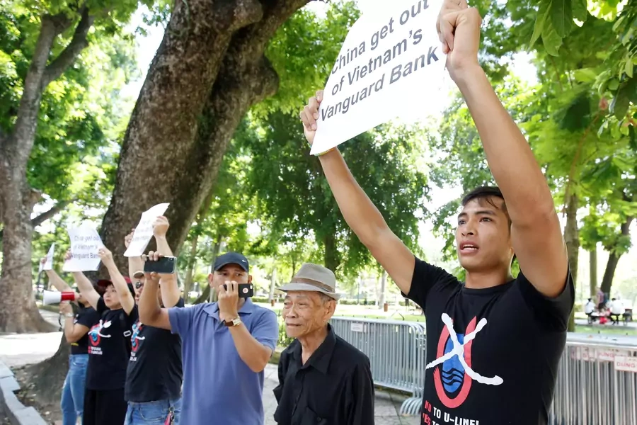 Anti-China protesters hold placards during a demonstration in front of the Chinese embassy in Hanoi, Vietnam on August 6, 2019.