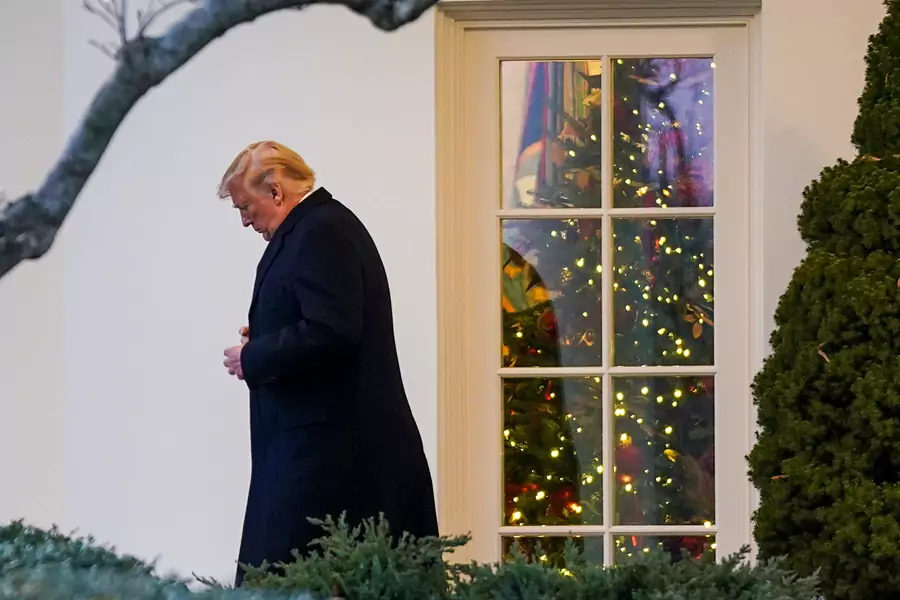 U.S. President Donald Trump exits the Oval Office as he departs the White House in Washington, DC, on December 18, 2019. 