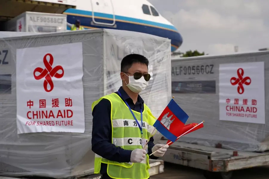 An airport worker is seen as a Chinese plane arrives with medical workers and supplies donated from China to Cambodia to contain the coronavirus disease (COVID-19) outbreak, at Phnom Penh International Airport in Cambodia, March 23, 2020. 