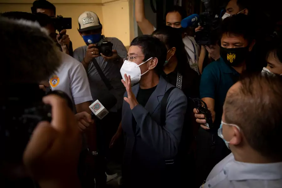 Maria Ressa walks out of Manila City Hall after being found guilty of cyber libel.