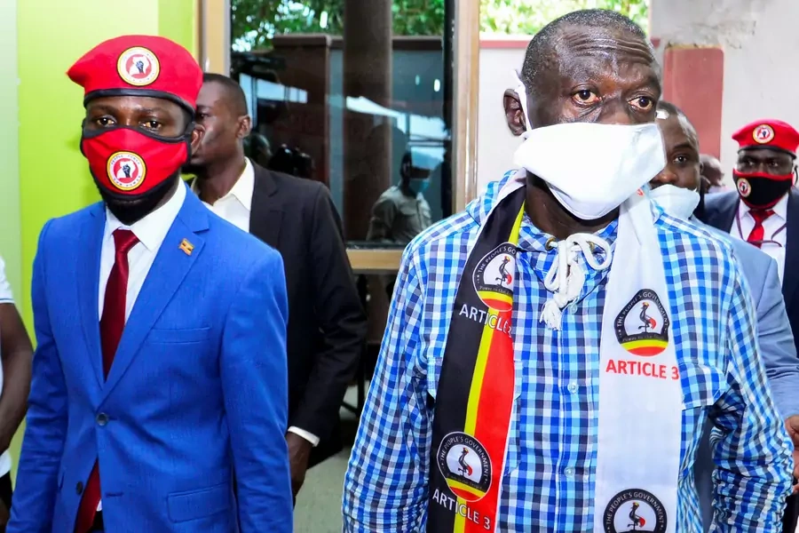 Ugandan opposition figures Bobi Wine and Kizza Besigye arrive for a joint news conference to discuss the government's handling of the pandemic and a possible alliance against President Yoweri Museveni in upcoming elections, Kampala, Uganda June 15, 2020
